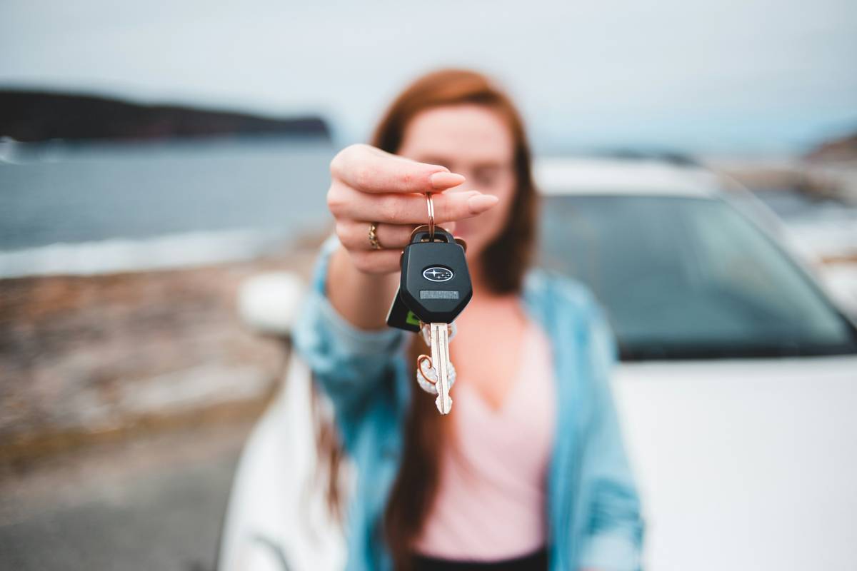 ownership of a car: mechanic inspecting engine during pre-purchase check